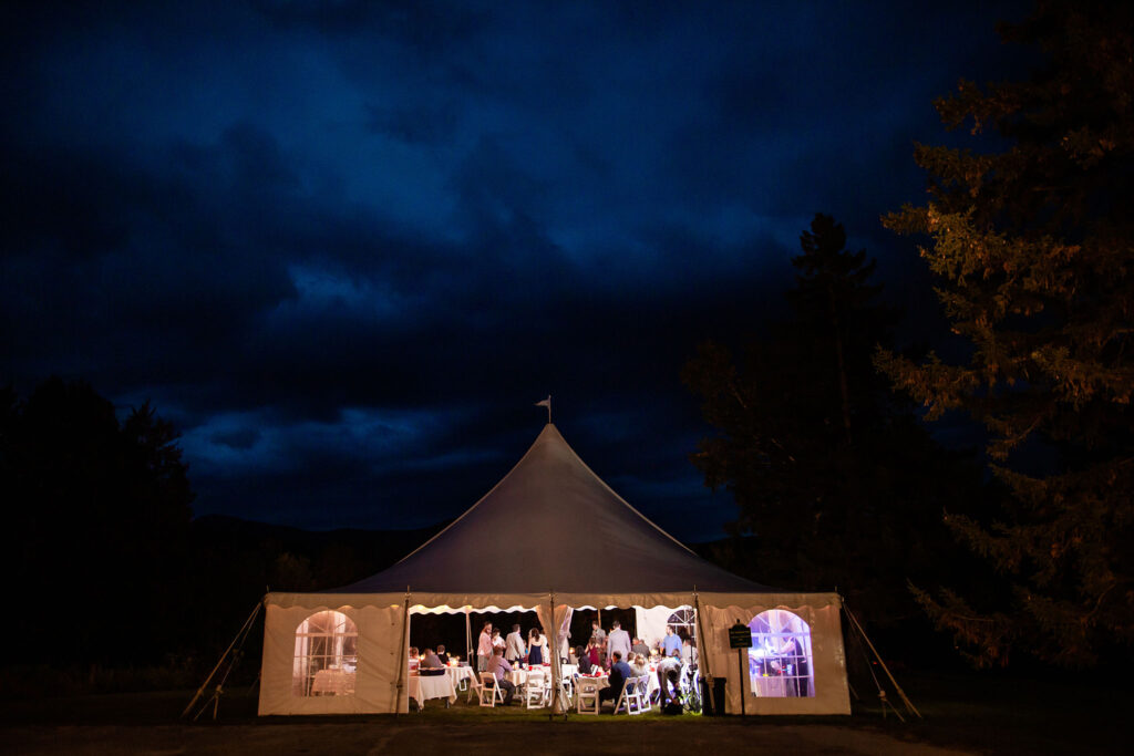 Night-time View of Wedding Tent, dark blue sky, inside tent lit