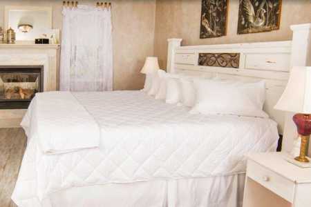 Guest Room with white bed and comforter